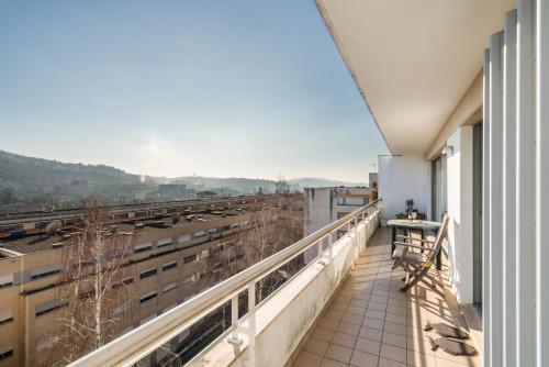 a balcony with a view of a train at Host Wise - Homely Large Flat - Balcony in Guimarães