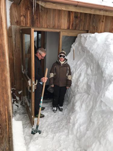 a couple of people standing in a snow cave at Hillary Hotel in Les Menuires