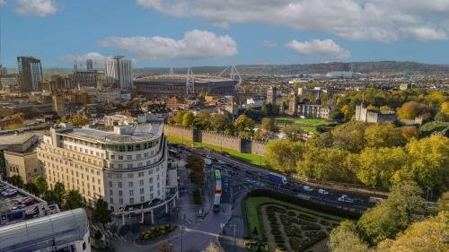 an aerial view of a city with buildings and roads at Hilton Cardiff in Cardiff