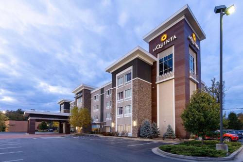 a hotel with a sign on the side of a building at La Quinta by Wyndham Morgantown in Morgantown