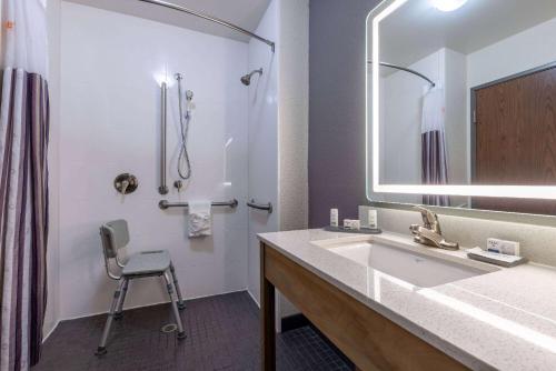 a bathroom with a sink and a shower at La Quinta by Wyndham Morgantown in Morgantown