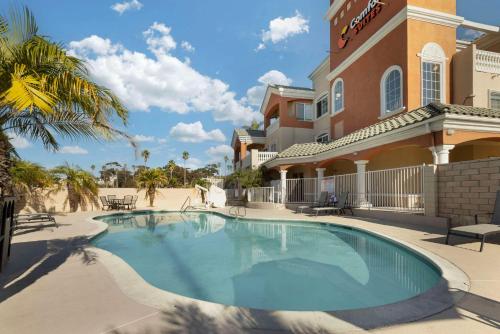 a swimming pool in front of a building at Comfort Suites Oceanside Camp Pendleton Area in Oceanside