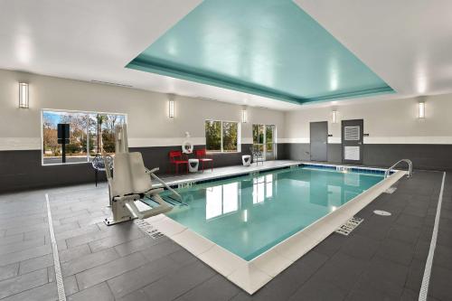 a large swimming pool in a building at Tru By Hilton Santee in Santee