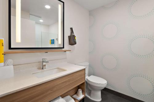 a bathroom with a sink and a toilet at Tru By Hilton Santee in Santee