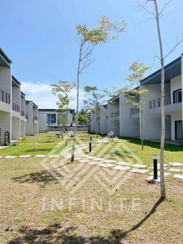 a view of the courtyard of an apartment building at Roxy Sematan Beach Townhouse Deluxe , 1 & 2 in Sematan
