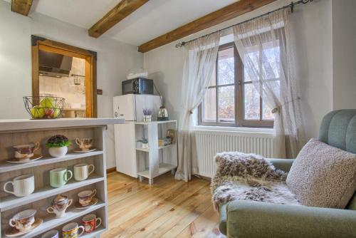 a living room with a couch and a window at 8BD Retreat in Bansko Comfort & Mountain Charm by Flat Mаnager in Bansko