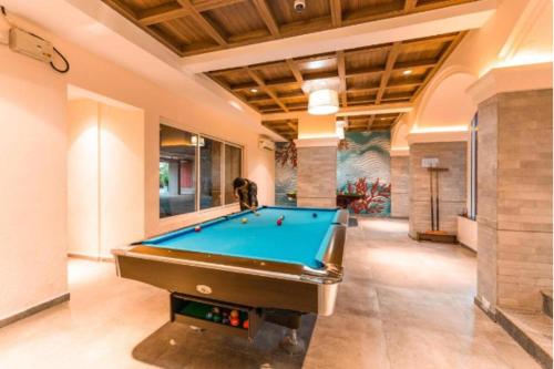 a large room with a pool table in it at Good Stay Studio Apartment 307 in Dabolim