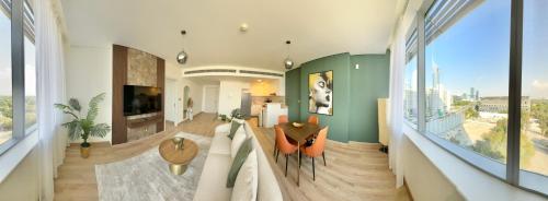 a living room with a view of a city at LUXURY SPACIOUS - 1 BR - SKY GARDENS DIFC - Heart of Trade Centre and Dubai Mall in Dubai