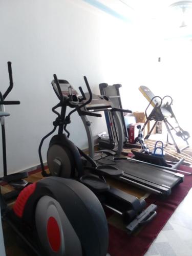a room with a bunch of exercise bikes in it at EKA ELITE HOTEL in Lomé