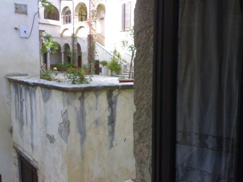 a view of a building from a window at Dormire nel Castello in Pitigliano