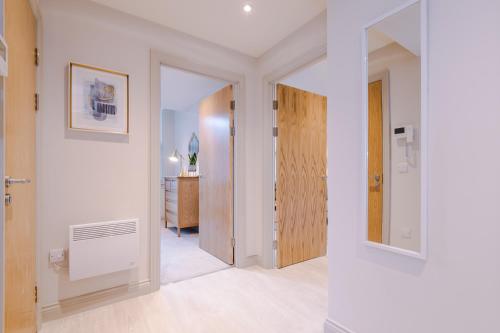 a hallway with a door leading to a room at Designer Central Leeds Home by PureStay sleeps 5 in Leeds