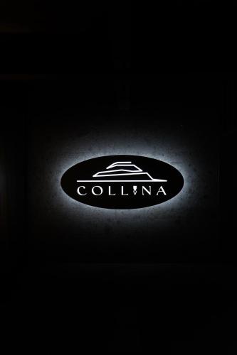 a lit up car sign in the dark at Collina Luxury Relais in Clusone