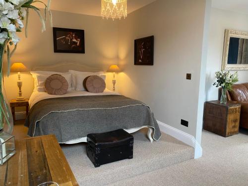 a bedroom with a large bed and a table at No 22 in Barnstaple