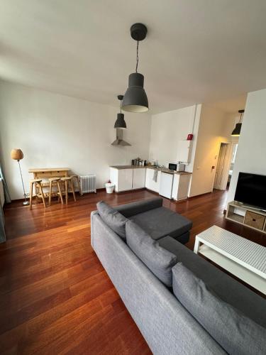a living room with a couch and a table at Elegant Grand Place Stays in Brussels