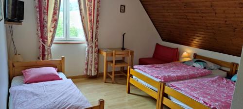 Postel nebo postele na pokoji v ubytování Chambre d'hôtes de la tulipe