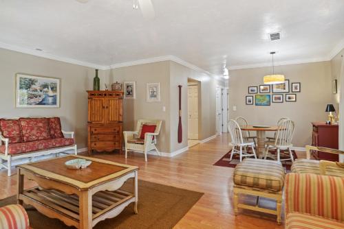 a living room with a couch and a table at 125 Cordillo Parkway in Hilton Head Island