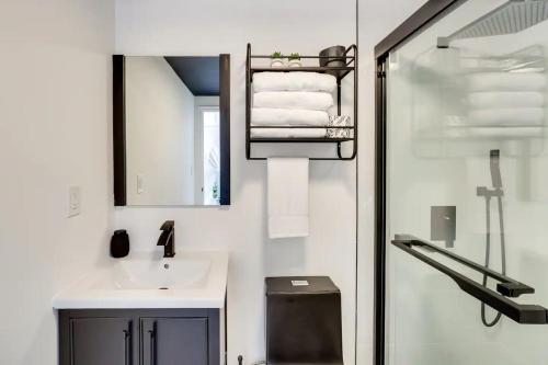 a white bathroom with a sink and a mirror at Unique Escapes - 007 Geodome in Monticello