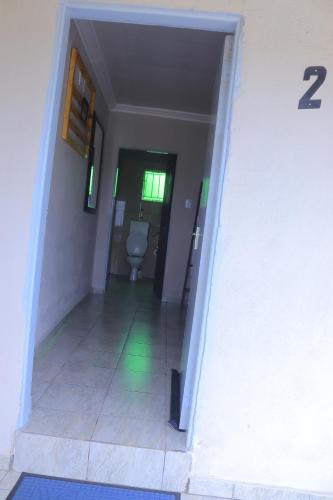 an empty hallway with a toilet in a bathroom at Lis ville guest house in Phalaborwa