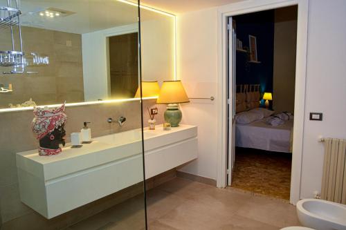 a bathroom with a sink and a mirror at Alba e i Mori in Palermo