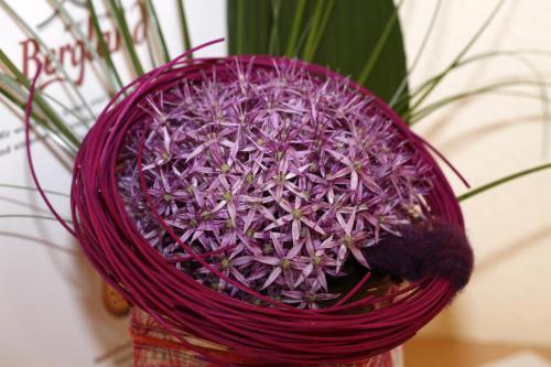 a purple flower in a purple basket at Apart-Pension Bergland in Ladis