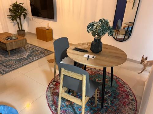 a dining room with a wooden table and chairs at Duke of the Dead Sea Crown Group Collection in Neve Zohar