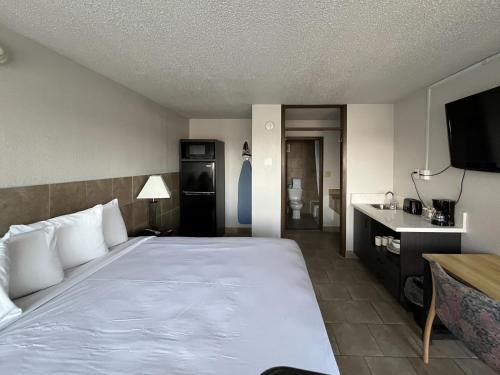 Säng eller sängar i ett rum på Motel 6 Mesquite, TX Town East