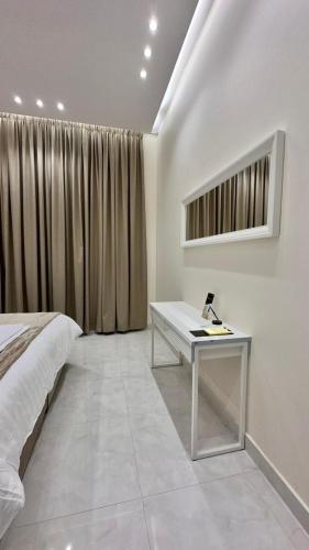 Ένα ή περισσότερα κρεβάτια σε δωμάτιο στο منتجعات رغيد الفندقية الزهرة