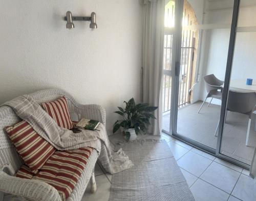 a living room with a couch and a table at Busa House in White River