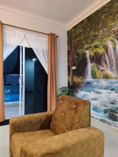 a couch in a living room with a waterfall mural at NASUHA HOMESTAY 1 TEMERLOH Semi-D House, 4 Bedroom, 3 Bathroom, 5 Unit Aircond, Free Wifi and Netflix, Near Hospital with Private Pool in Temerloh