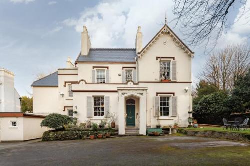 a large white house with a large driveway at Eastfield in Liverpool