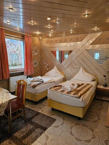 Postel nebo postele na pokoji v ubytování Hotel Tenne