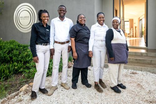 a group of people standing in front of a house at Unembeza Boutique Lodge & Spa in Hoedspruit