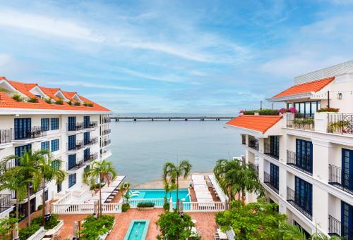 an aerial view of the ocean between two buildings at Sofitel Legend Casco Viejo, Panama City in Panama City