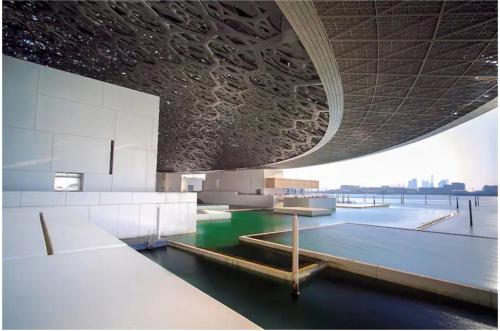 a view of a building with a pool of water at Corniche Street - New Suave Room in Abu Dhabi