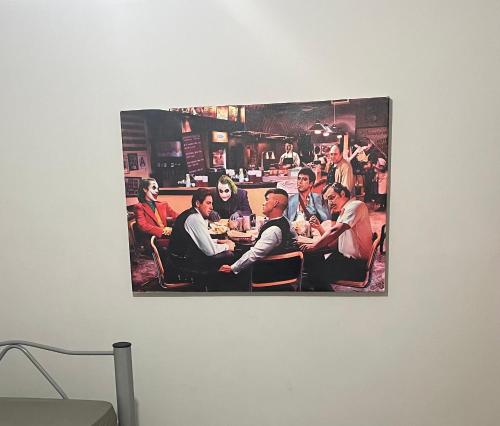 a picture of a group of people sitting at a table at Escondidinho Bar, hostel e casa de festas in Rio de Janeiro