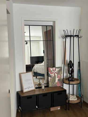 a room with a table with a mirror and a bed at Magnificent apartment, Geneva Center, Geneva Lake in Geneva