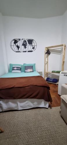a bedroom with a bed and a mirror at Sambódromo Lapa Santa Teresa Centro in Rio de Janeiro