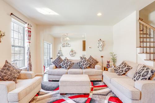 a living room with two couches and a rug at Spacious Ewing Township Home Home Gym and Deck! 