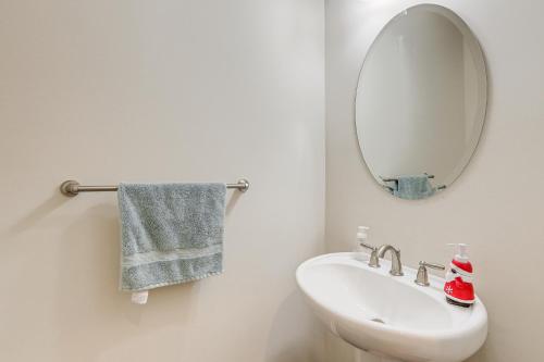 a bathroom with a white sink and a mirror at Spacious Ewing Township Home Home Gym and Deck! 