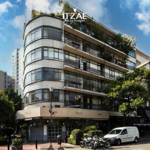 a tall building with a car parked in front at Casa Itzae B&B Polanquito Dog Friendly in Mexico City