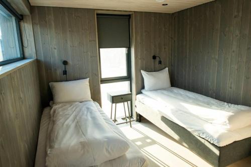 En eller flere senger på et rom på Ny leilighet i Henningsvær!