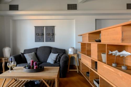 a living room with a couch and a table at Seaside Resort Home in Pylos