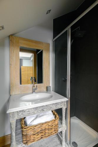a bathroom with a sink and a shower at Seaside Resort Home in Pylos