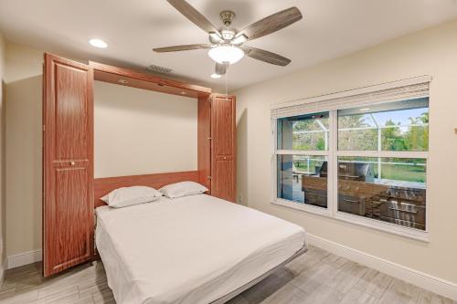 a bedroom with a bed and a window at Casa Bonita in Bonita Springs