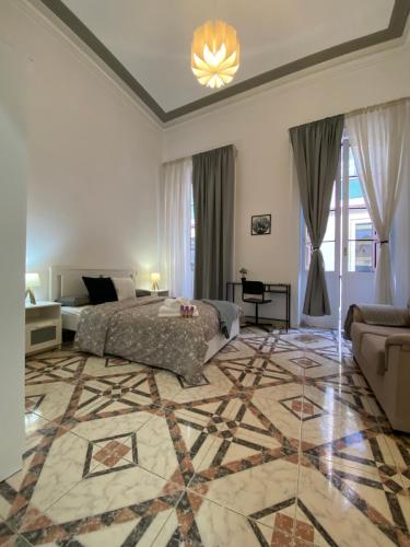 a bedroom with a bed and a large rug at Isor Triana in Las Palmas de Gran Canaria