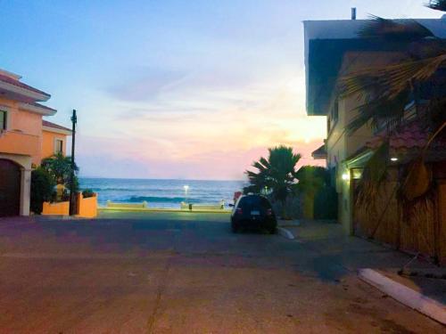 a car parked on a street near the ocean at Departamento en el Área de Olas Altas in Mazatlán