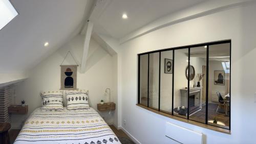 Postelja oz. postelje v sobi nastanitve Appartement Design & Calme - Au centre de Tulle!