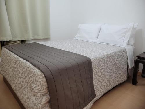 Säng eller sängar i ett rum på Flat Manhattan Residence Service