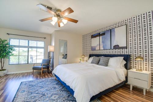 a bedroom with a large bed and a ceiling fan at Spacious Scottsdale Home with Private Heated Pool in Scottsdale