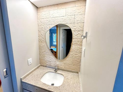 a bathroom with a sink and a mirror at STAY Blend SmartStyle in Goiânia